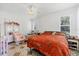 Well-lit bedroom showcases decorative tile flooring, a ceiling fan and plenty of natural light at 4357 Mermell Cir, North Port, FL 34291