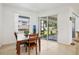 Cozy dining area with sliding glass door access to outdoor space and lots of natural light at 4357 Mermell Cir, North Port, FL 34291