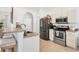 Functional kitchen featuring stainless steel appliances, tile flooring, and ample counter space at 4357 Mermell Cir, North Port, FL 34291