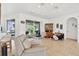 Bright living area featuring tile flooring, recessed lighting, and outdoor access at 4357 Mermell Cir, North Port, FL 34291