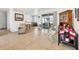 Bright living room showcasing tile floors and sliding glass doors to lanai at 4357 Mermell Cir, North Port, FL 34291