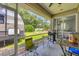 Back patio with barbecue grill and seating at 4357 Mermell Cir, North Port, FL 34291