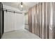 Bedroom with marble floors and modern light fixture at 4507 9Th W St # J11, Bradenton, FL 34207
