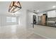 Open-concept kitchen with stainless steel appliances, granite countertops, and modern finishes at 4507 9Th W St # J11, Bradenton, FL 34207