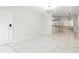 Open floor plan with marble floors, modern lighting, and a doorway with curtains at 4507 9Th W St # J11, Bradenton, FL 34207