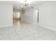 Open-concept room features marble floors, modern lighting, and ample natural light at 4507 9Th W St # J11, Bradenton, FL 34207
