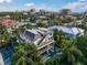Aerial view of the modern home featuring rooftop deck, outdoor living space, and private pool at 455 Cleveland Dr, Sarasota, FL 34236