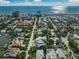 Wide aerial view of the neighborhood showcasing the home's proximity to the beach at 455 Cleveland Dr, Sarasota, FL 34236