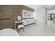 Bright bathroom featuring a modern vanity, marble floors, and stylish fixtures at 455 Cleveland Dr, Sarasota, FL 34236