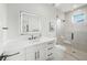 Sleek bathroom featuring modern vanity, glass shower, and contemporary fixtures at 455 Cleveland Dr, Sarasota, FL 34236