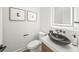 Chic powder room features modern fixtures and a unique vessel sink at 455 Cleveland Dr, Sarasota, FL 34236
