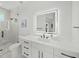 Elegant bathroom featuring modern vanity, glass shower, and contemporary fixtures at 455 Cleveland Dr, Sarasota, FL 34236