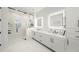 Contemporary bathroom featuring a glass shower, double sink vanity, and modern lighting at 455 Cleveland Dr, Sarasota, FL 34236