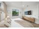 Cozy bedroom features chic, neutral decor and modern wood furniture at 455 Cleveland Dr, Sarasota, FL 34236