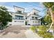 Luxury modern home with multi-level balconies and tropical landscaping at 455 Cleveland Dr, Sarasota, FL 34236