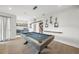 Game room boasts stylish decor, built-in bar and sleek pool table at 455 Cleveland Dr, Sarasota, FL 34236