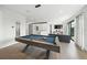 Game room with pool table and comfortable living room setup at 455 Cleveland Dr, Sarasota, FL 34236