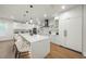 Modern kitchen with a large island and bright white cabinets at 455 Cleveland Dr, Sarasota, FL 34236