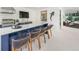 Outdoor kitchen area with island, bar seating, and stainless grill at 455 Cleveland Dr, Sarasota, FL 34236