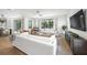 Bright and spacious living room featuring modern decor, large windows, and access to the outdoors at 455 Cleveland Dr, Sarasota, FL 34236