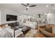 Spacious living area with a modern open layout, flowing into the kitchen with sleek countertops at 455 Cleveland Dr, Sarasota, FL 34236