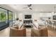 Bright living room with modern decor, large windows, and seamless integration with the kitchen area at 455 Cleveland Dr, Sarasota, FL 34236