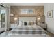 Comfortable bedroom with stylish decor, a large window, and a cozy ambiance at 455 Cleveland Dr, Sarasota, FL 34236