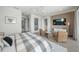 Well-designed bedroom featuring a modern aesthetic, decorative wall panel, and comfortable seating at 455 Cleveland Dr, Sarasota, FL 34236