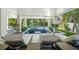 Beautiful luxury lounge area with stunning blue marble in the pool at 455 Cleveland Dr, Sarasota, FL 34236