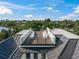 A spacious rooftop deck with lounge chairs and panoramic views of the surrounding landscape at 455 Cleveland Dr, Sarasota, FL 34236