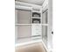 Organized walk-in closet with custom shelving, drawers, and ample storage space at 455 Cleveland Dr, Sarasota, FL 34236