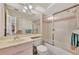 Well-lit bathroom with a bathtub and shower combo, large mirror, and vanity with a sink at 495 Oak Hill Cir # 44, Sarasota, FL 34232