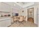 Cozy breakfast nook featuring a round table, four chairs, and a textured ceiling at 495 Oak Hill Cir # 44, Sarasota, FL 34232