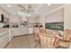 Eat-in kitchen with tile floors, decorative ceiling, and abundant natural light at 495 Oak Hill Cir # 44, Sarasota, FL 34232