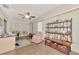 Cozy living room features tile floors, ceiling fan, desk and comfortable seating arrangements at 495 Oak Hill Cir # 44, Sarasota, FL 34232