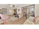 Comfortable living room featuring a desk area, and sliding glass doors to outdoor space at 495 Oak Hill Cir # 44, Sarasota, FL 34232