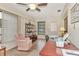 Bright living room with tile floors, cozy seating area, desk, and natural light at 495 Oak Hill Cir # 44, Sarasota, FL 34232