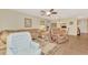Open living area with view to the dining room, featuring ample seating and natural light at 495 Oak Hill Cir # 44, Sarasota, FL 34232