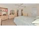 Bedroom with neutral decor, large bed, dresser with mirror, and tile floors at 495 Oak Hill Cir # 44, Sarasota, FL 34232