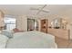 Bedroom with a large bed, sliding doors to an outdoor space, and a dresser with mirror at 495 Oak Hill Cir # 44, Sarasota, FL 34232