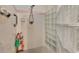 Updated shower with glass block wall, tile flooring and modern fixtures at 495 Oak Hill Cir # 44, Sarasota, FL 34232