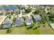 An aerial view showcases two screened in lanai pools with lush landscaping at 5078 47Th W St, Bradenton, FL 34210