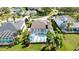 Aerial view of a screened in pool and lanai, and lush landscape at 5078 47Th W St, Bradenton, FL 34210
