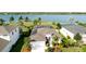 Aerial view of a home with a screened-in pool, well-manicured lawn, and waterfront views at 5078 47Th W St, Bradenton, FL 34210