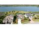 Aerial view showcasing the home's pool, landscaping, and proximity to waterfront at 5078 47Th W St, Bradenton, FL 34210