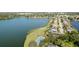 Aerial view of a property with a tennis court and pool in a lakeside community at 5078 47Th W St, Bradenton, FL 34210