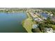 Aerial view of a property with a tennis court and pool in a lakeside community at 5078 47Th W St, Bradenton, FL 34210