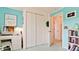 This secondary bedroom features a closet, adjacent doorway, and wicker desk space for a comfortable and functional area at 5078 47Th W St, Bradenton, FL 34210