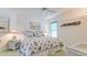 Bright bedroom with a queen bed, wicker accents, and nautical-themed decor creating a relaxing and coastal atmosphere at 5078 47Th W St, Bradenton, FL 34210
