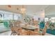 Charming dining area with room for six and sliding glass door leading to the lanai at 5078 47Th W St, Bradenton, FL 34210